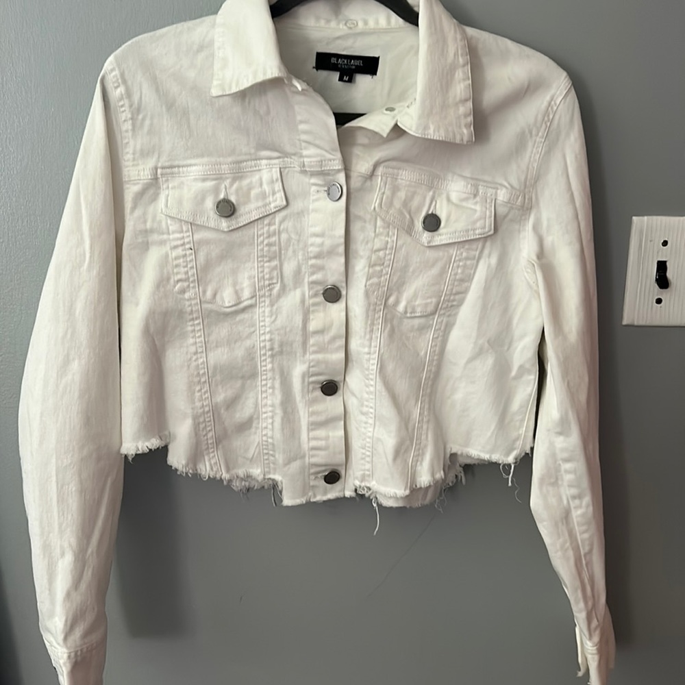 “C’est TIO black label” white jean jacket with 2 pockets some ripped designs.